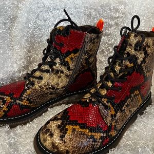 Brown and red combat boots.